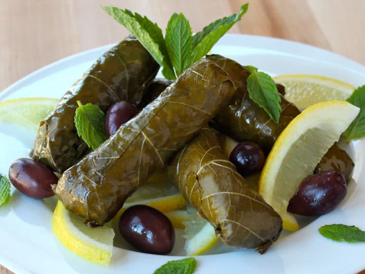 Vegetarian Stuffed Grape Leaves - Learn to make vegetarian stuffed grape leaves, also known as dolmades, with rice, pine nuts, dill, mint, and lemon. Kosher, pareve, gluten free.