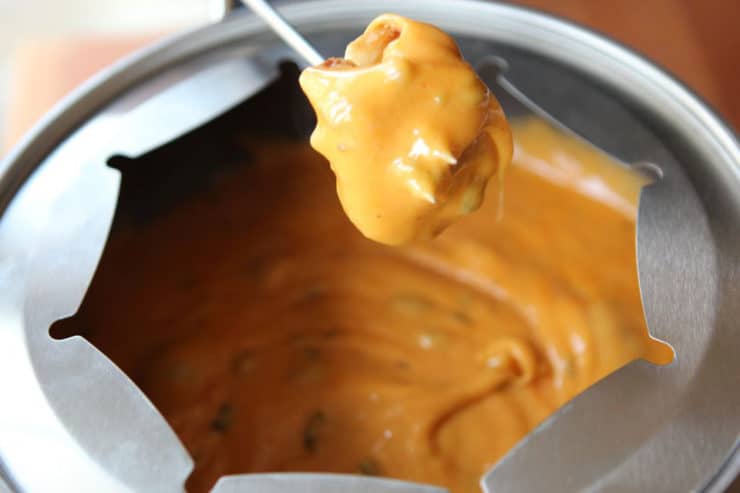 Cheesy Roasted Jalapeño Fondue - Non-alcoholic cheese fondue made with cheddar cheese, pepper jack cheese, milk, lemon juice, roasted jalapenos and smoked paprika. Kosher, dairy.