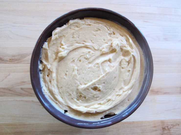 Spread half the cinnamon honey butter smoothly in the bowl.