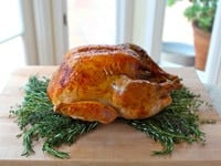 Classic Roast Turkey on a cutting board.