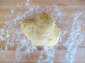 CHallah dough on a floured surface.