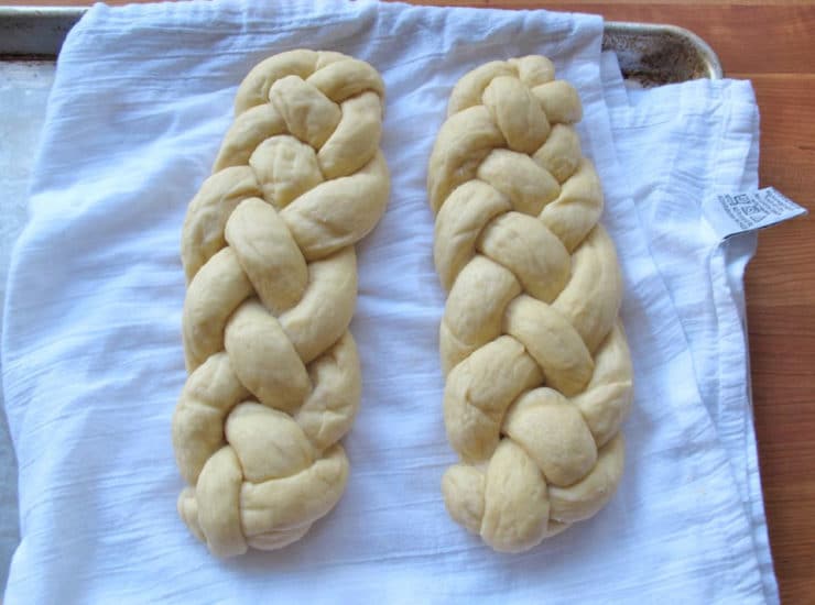 Dipped challah draining on towels.