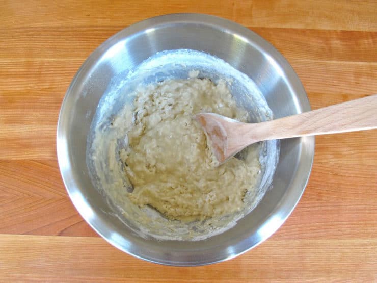 Gradually stir flour into water with a wood spoon.
