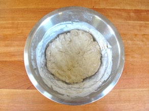 Knead dough with hands when too stiff for a spoon.
