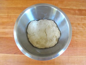 CHallah dough in a greased bowl to proof.