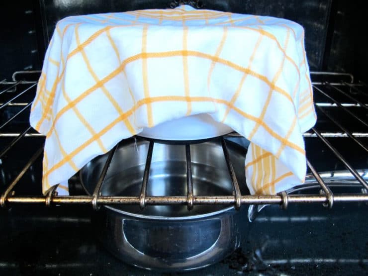 Bread dough proofing in cold oven with hot water.