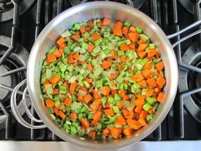Carrots and celery to saute in a skillet.