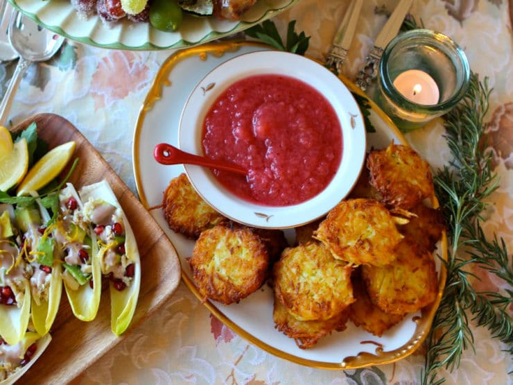 A Thanksgiving Potluck table adorned with various dishes and a bowl of savory sauce