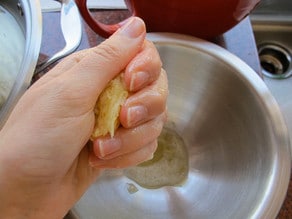 Squeezing moisture out of a latke.