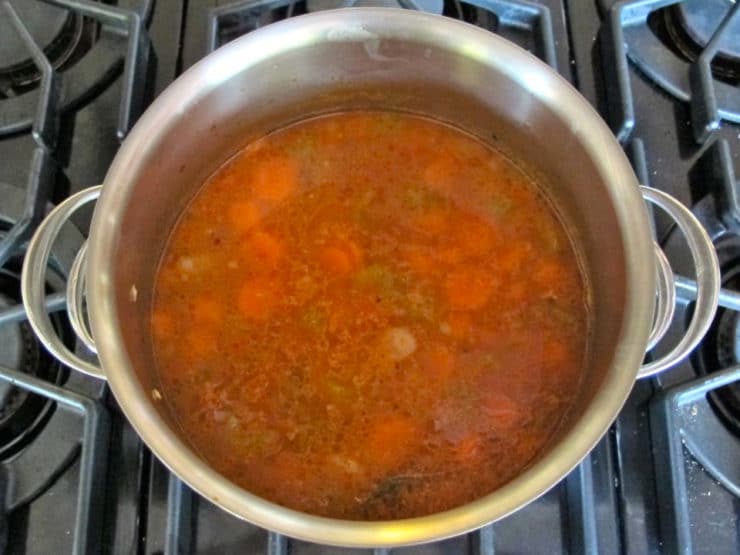 Butter bean soup simmering in a stockpot.