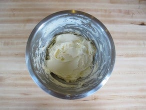 Butter and sugar creamed in a mixing bowl.