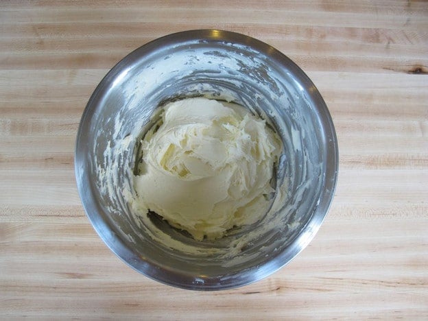 Butter and sugar creamed in a mixing bowl.