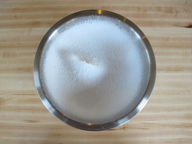 Powdered sugar sifted into a bowl.