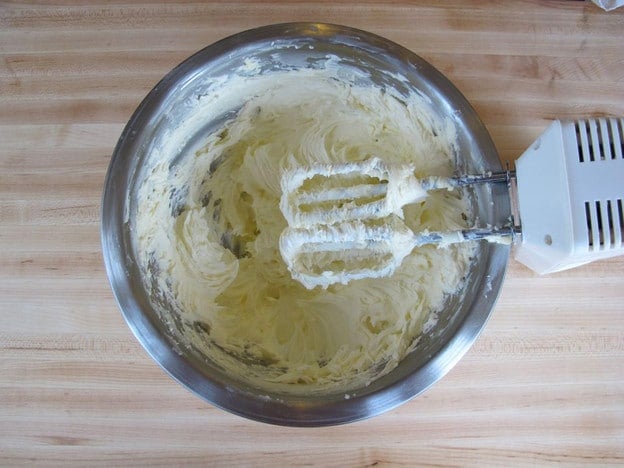 Buttercream frosting whipped in a bowl.