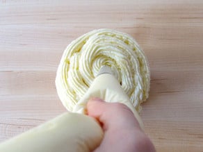 Pipe frosting in a swirl to center of cupcake.