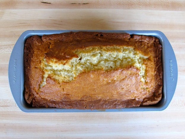 Baked coconut cake in a loaf pan.