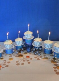 Menorah Cupcakes set up on the table with candles.