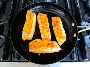 Sear fish fillets in a hot skillet.