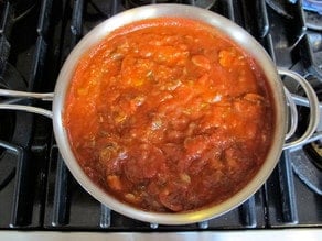 Mushrooms added to tomato sauce.