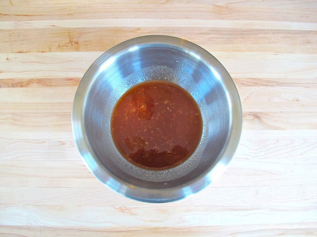 Pineapple sweet sour sauce in a mixing bowl.