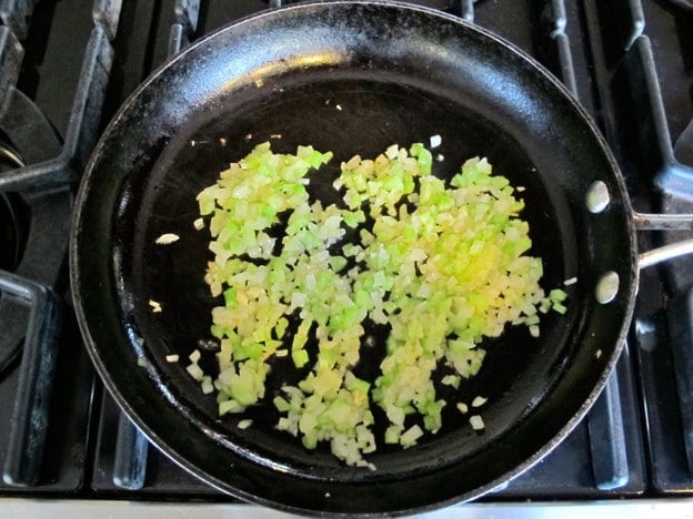 Minced celery and onion in a skillet.