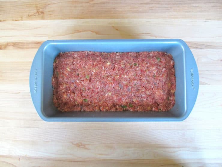 Press meatloaf mixture into a loaf pan, rounding the top.