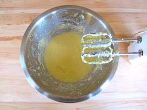 Beat butter and sugar in a mixing bowl with a hand mixer.