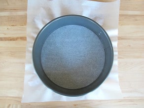 Line a springform pan with parchment paper.