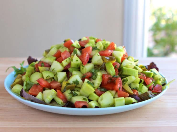 Israeli Salad with Pickles and Mint - Learn the history of Israeli salad and try my recipe, inspired by News Cafe Miami. Kosher, Vegan, Gluten Free, Healthy.