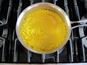 Cooking couscous in chicken broth.