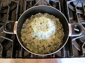 Cooked rice shaped like a volcano in a stockpot.