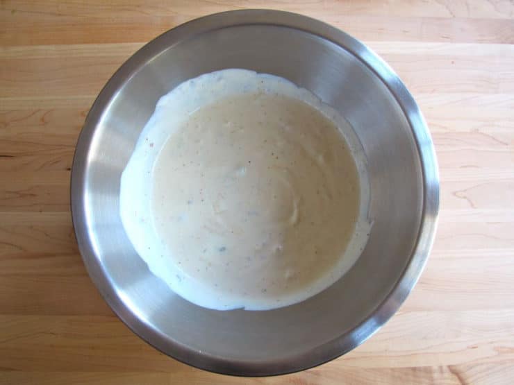 Sour cream and seasoning in a bowl.