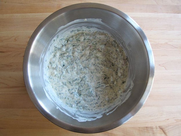 Spinach stirred into sour cream.