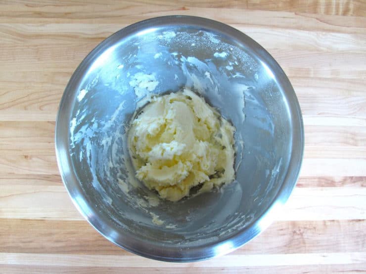 Beaten frosting in a bowl.