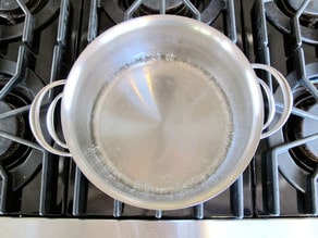 Sugar and water in a stockpot.