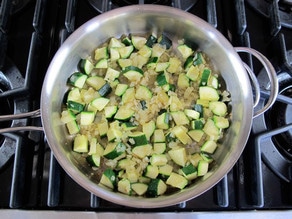 Diced zucchini added to skillet.