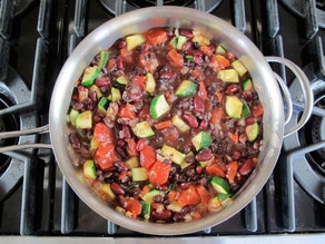 Vegetables added to skillet to saute.