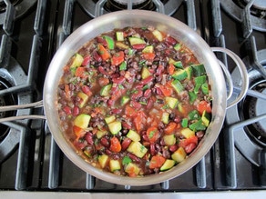 Vegetables added to skillet to saute.