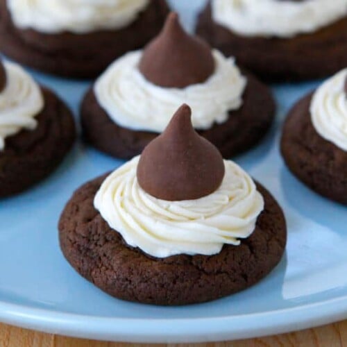 Chocolate cookies with frosting on top, decorated with a Hershey