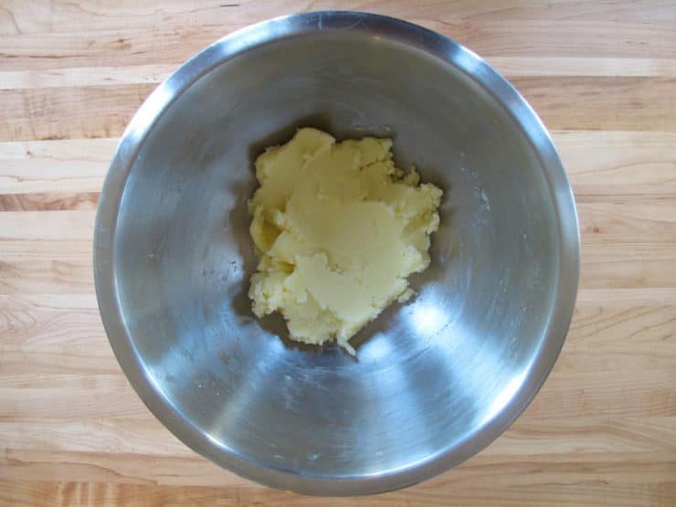 Creaming butter and sugar in a bowl.