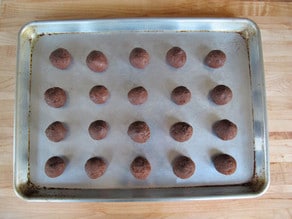 Rolled cookie dough on a baking sheet.