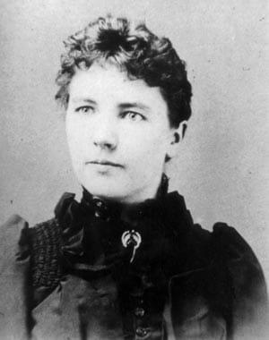 Black and white photograph of Laura Ingalls Wilder in a black dress.