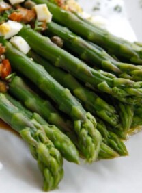 Marinated asparagus topped with chopped vegetables