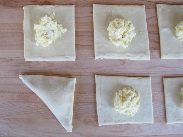 Fold dough into triangle over filling.