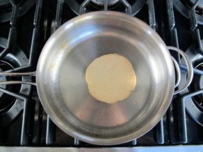 Cooking pancake batter on hot skillet