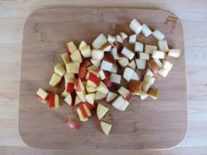 Chopped apple and pear on a cutting board.