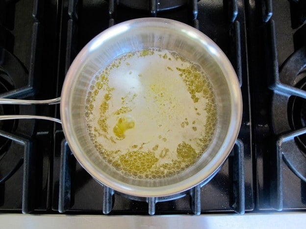 Melting butter in a saucepan.