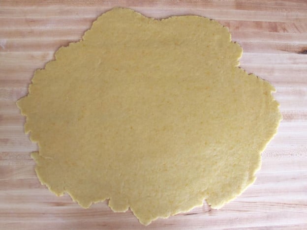 Dough rolled out on a board.