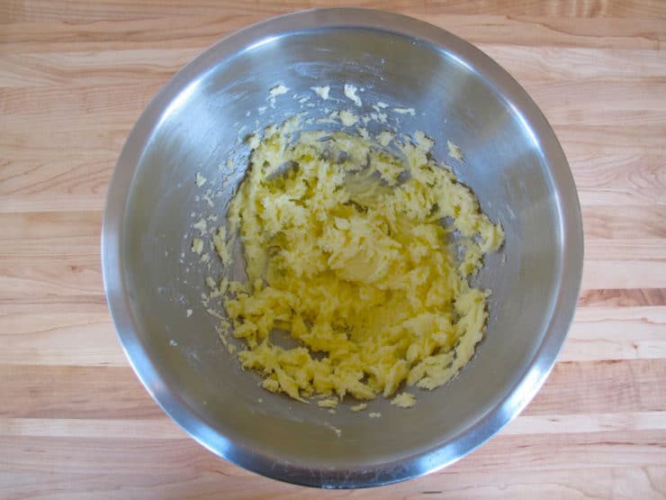 Sugar beaten into butter in a mixing bowl.