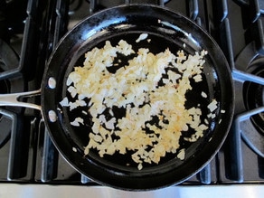 Diced onion in a skillet.